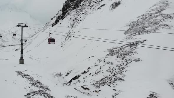 Cableway Lifting in Winter Mountains alt