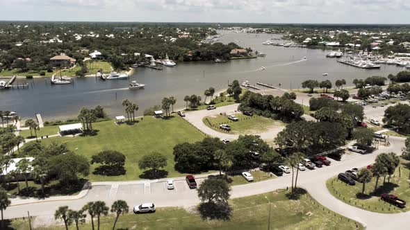 Aerial view of yacht motoring up the inlet in south Florida alt