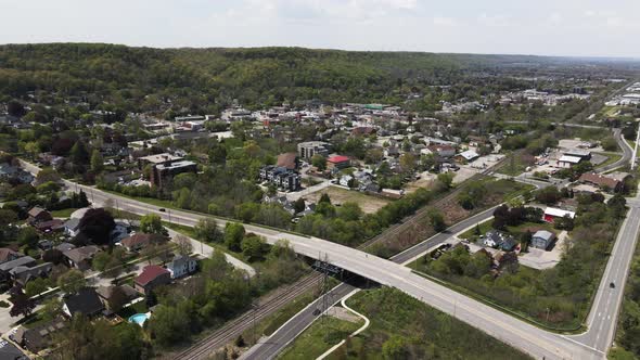 Aerial view showing bridge and intersection in Grimsby Village during sunny day in front of green hi alt