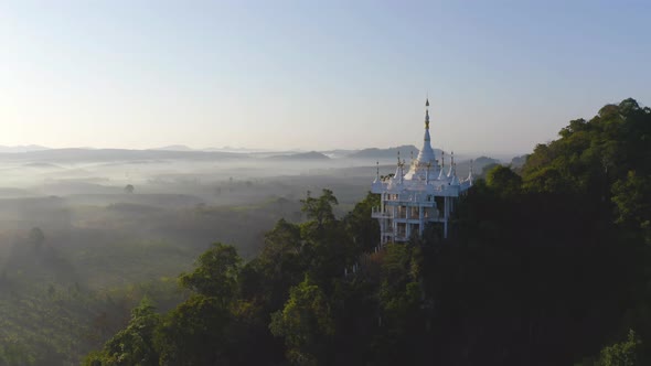 Aerial view of Khao Na Nai pagoda stupa. Luang Dharma Temple Park with green mountain alt