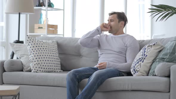 Coughing Sick Adult Man Sitting on Couch, Cough alt