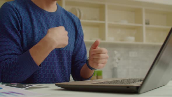 Deaf Man Talking with Sign Language While Making Video Call Online on Laptop alt