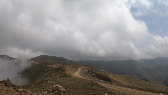 Sun, fog and clouds on the top of the mountain