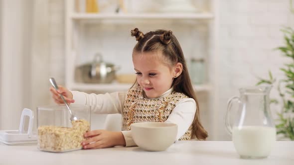 Child Put Cereal in a Bowl