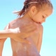 Caring Mother Apply Sunblock to the Back and Legs of Her Little Daughter - VideoHive Item for Sale