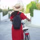 Back View Young Female Bicyclist with Bike Walking on Street in Slow Motion - VideoHive Item for Sale