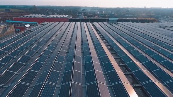 Factory roof with solar panels. Aerial view of the solar energy on rooftop alt