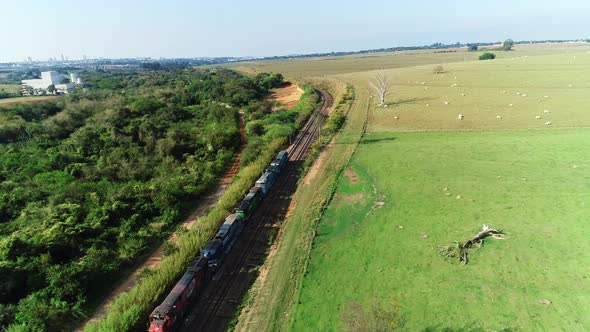 Aerial video of a train in movement at Indaiatuba, Sao Paulo, Brazil. alt