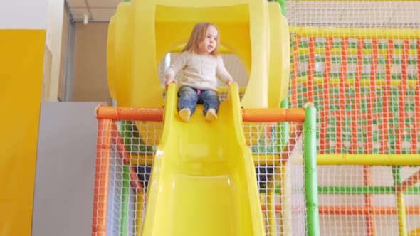 Happy Baby Riding Down Slide Children's Play Center Kindergarten Funny