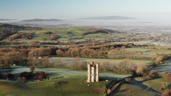 Aerial drone video of Broadway Tower, a famous iconic tourist attraction in The Cotswolds Hills, ico alt