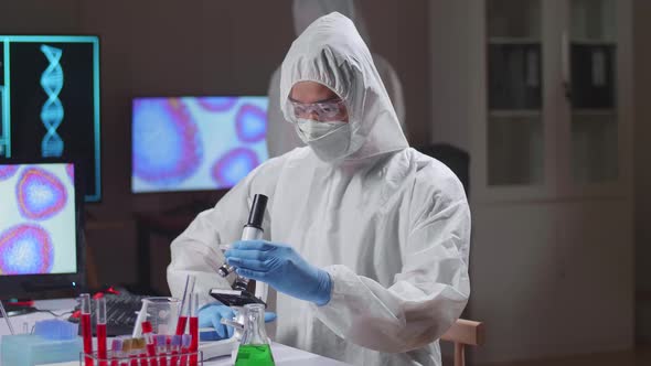 Asian Doctor Is Doing A Science Experiments And Developing Vaccine In A Modern Laboratory alt