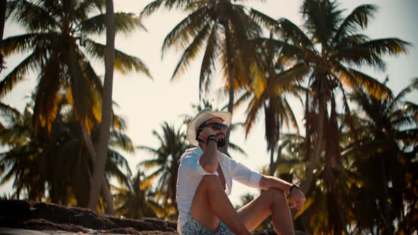 Beautiful Man On Vacation. Happy Guy Resting On Coast Hotel Luxury. Tanned Man Relaxing Vacation. alt