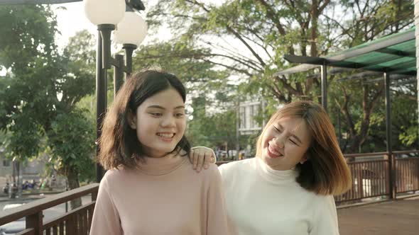 girls couple friend travel walk in the city street relax talk with smile face.