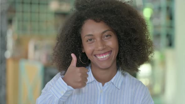 Portrait of Positive African Businesswoman Doing Thumbs Up alt