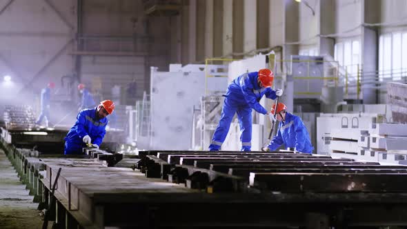 Factory workers with concrete plate