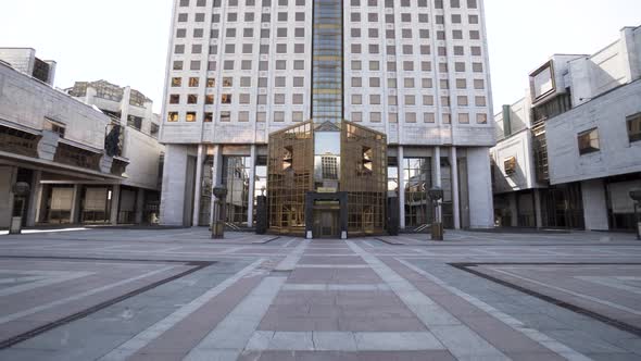 Golden glass facade entrance to the modern building alt