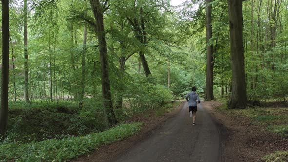Man Running Through Forest