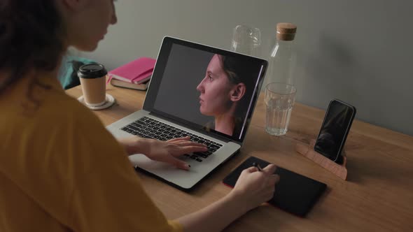 Woman Working with Photos on Her Laptop