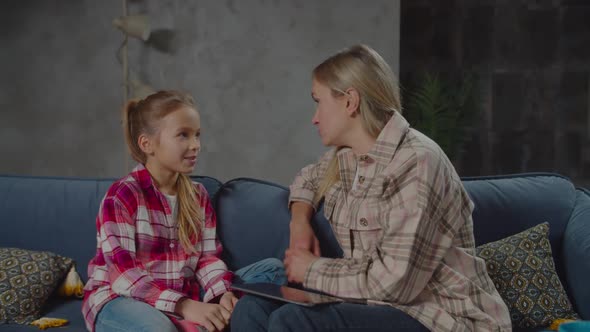 Chatting Pretty Mother and Daughter Bonding on Sofa alt