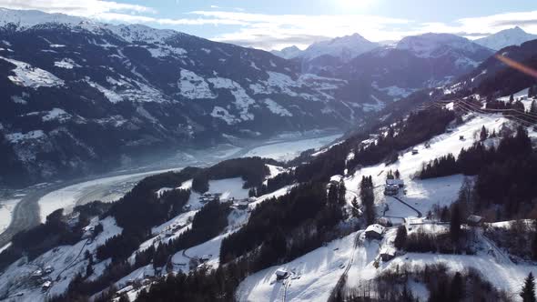 Alps Cold Mountain Top Snow Drone Flyover the Mountains and Skiing Village