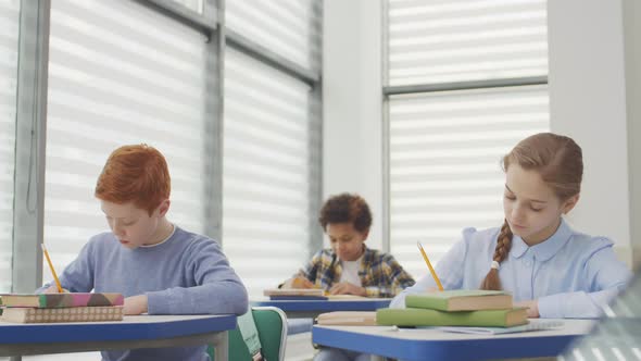 Pupils Finishing Doing Exercise during Lesson alt