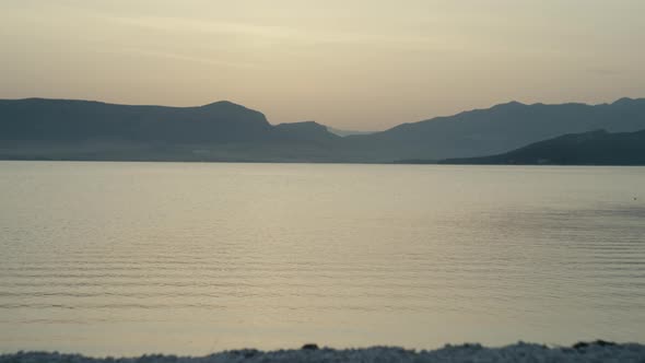 Background Video of the Morning Sea and Mountains alt