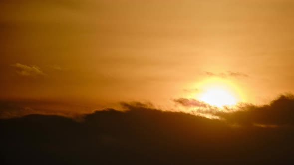 Evening dramatic sky with clouds during sunset, timelapse. The sun sets ...