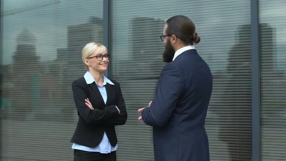 Businesspeople Discussing Cooperation Plan on Informal Meeting Outdoors, Chat