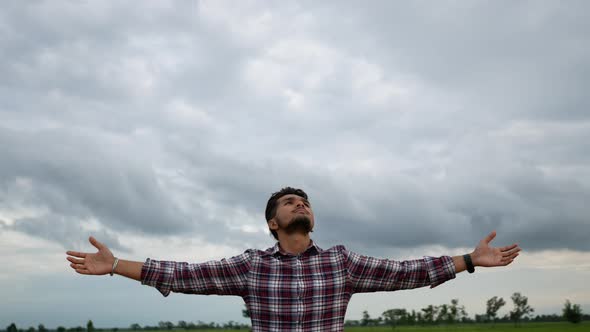 Men stand relax in the rice field. alt
