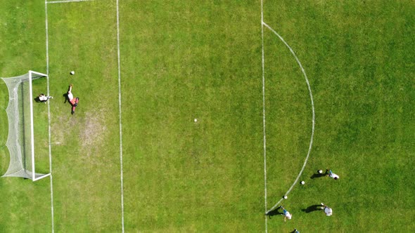 Training Of A Professional Football Team At The Stadium. Footballers Train Shots On Goal.