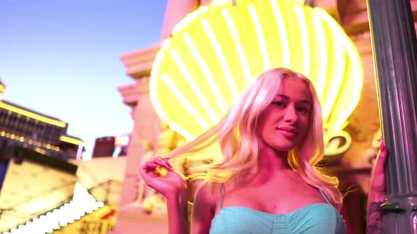 Young Sexy Blonde Woman in Shiny Exterior of Las Vegas Strip USA Slow Motion alt