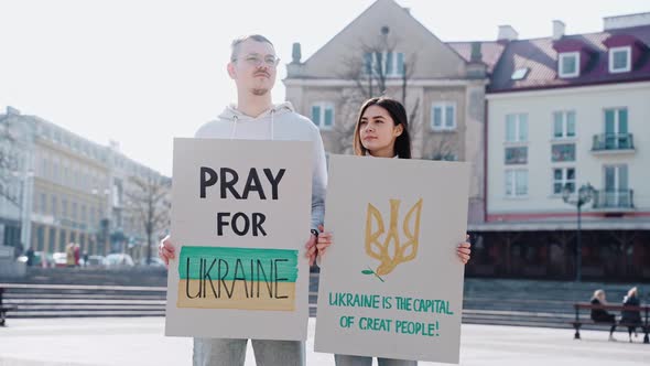 Young People Stand on the Street with Posters Calling to Stop the War in Ukraine
