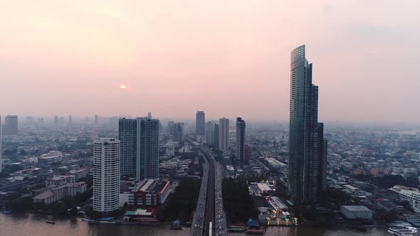 4k Aerial city view of Bangkok dowtnown, Flying over Bangkok, Thailand. alt
