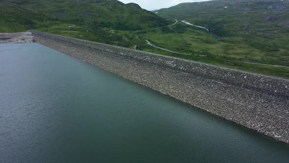 Top view inside water reservoir Sysendammen in Hardangervidda National Park Norway - Aerial showing alt