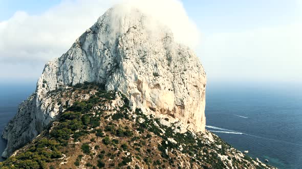 Mountain surrounded by clouds in Calpe Spain Beach Coast, 