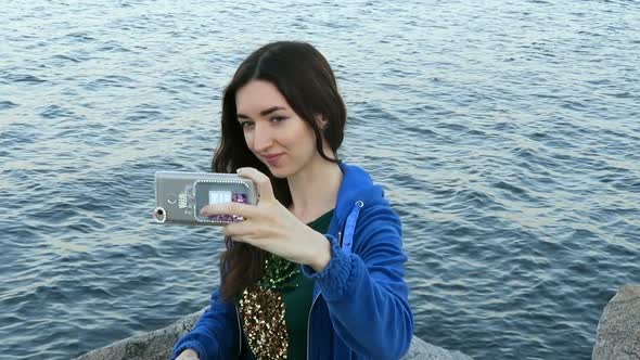 Girl Makes Selfie On The Background Of The Sea 2 alt