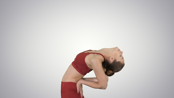 Young attractive woman practicing yoga stretching in Ustrasana alt