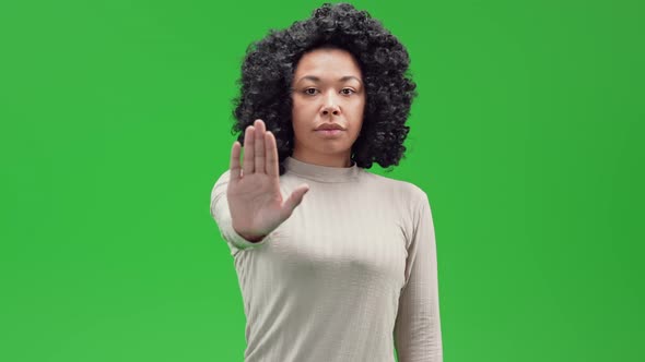 Green Screen Young African Female Stretch Out Palm to Camera