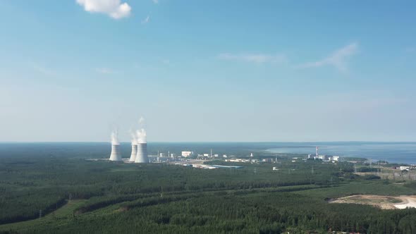 Smoking Cooling Towers at Nuclear Power Plant alt