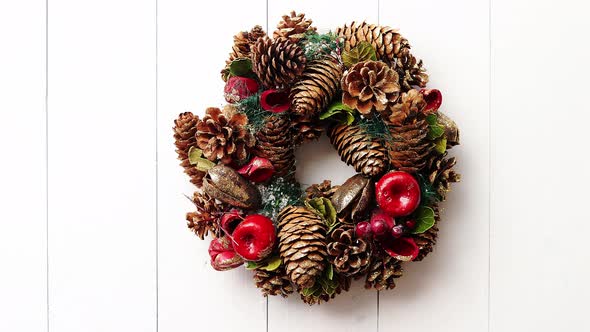 Christmas Wreath on White Wooden Background alt