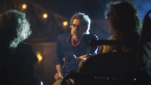 Director Giving Instructions to Actors During Rehearsal alt