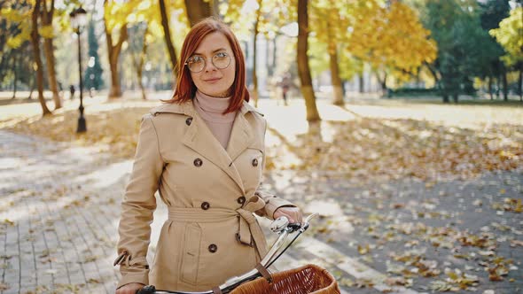 Young Redhead Female is Smiling Looking at you alt