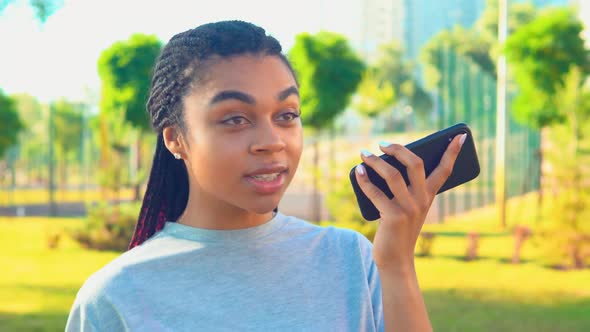 Closeup African American Woman Send Voice Message Outside Lifestyle alt