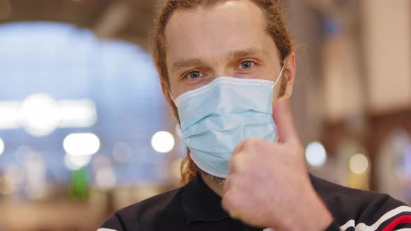 Close Up Young Stylish Hipster Guy in Protective Face Mask Show Thumb Up Like Gesture alt