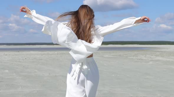 Beautiful Woman Walking on Shore