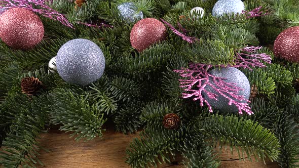Abies nobilis branch with cones and Christmas balls alt