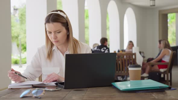 Focused Woman Office Manager Working on Documents Outside RED Helium 8K alt