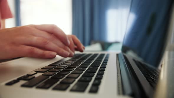 Hands Texting on Laptop Keyboard Close Up alt