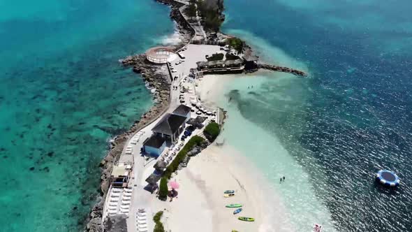 Aerial drone footage of the beautiful Pearl Island in the Bahamas near Nassau, showing the beach
