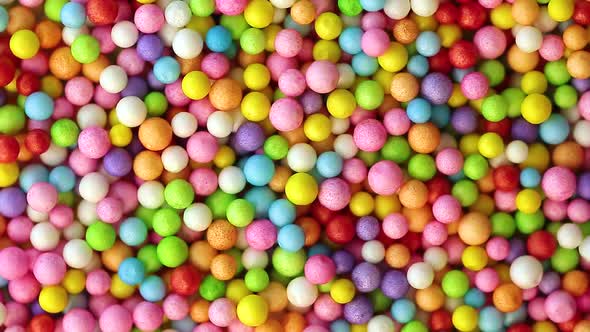 Multicolored balloons top view with circular rotation as background and texture.  alt